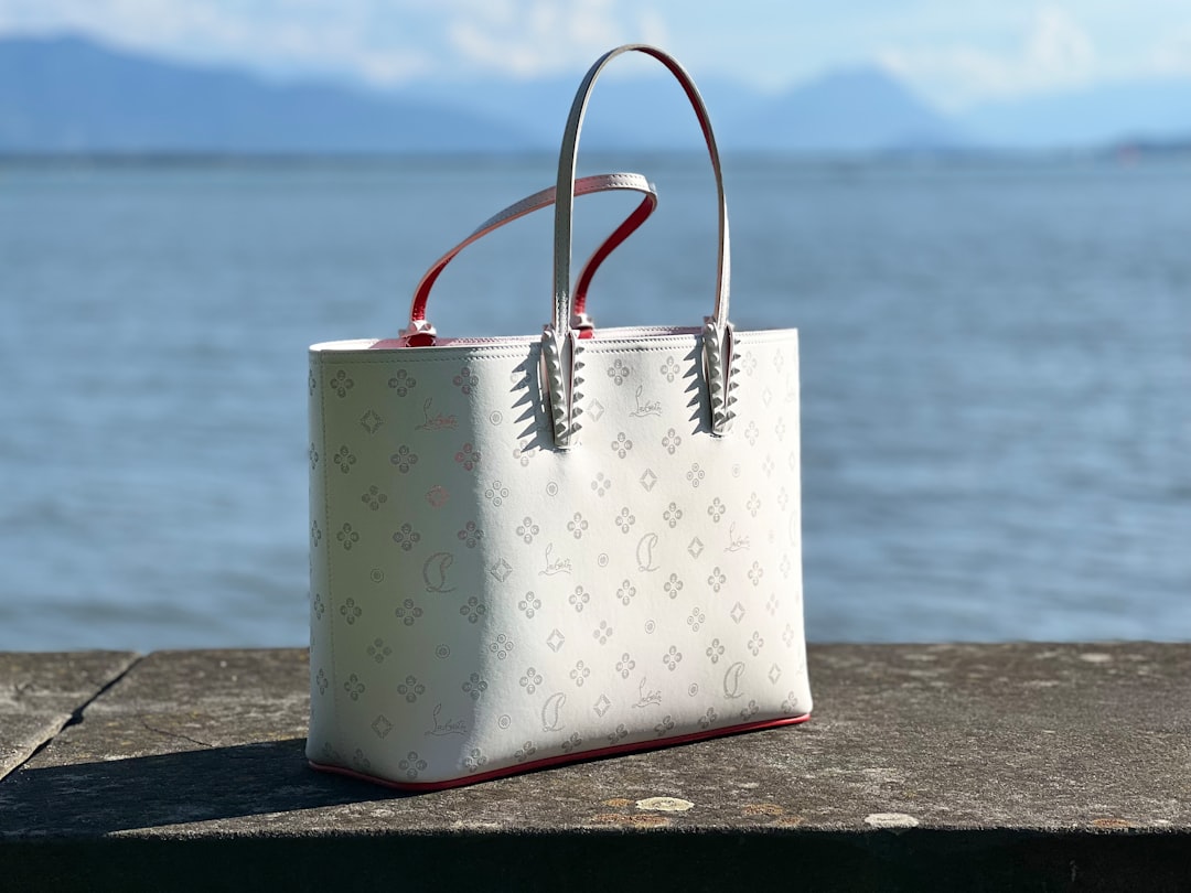 a-white-purse-sitting-on-top-of-a-wooden-table-jdkntwei0su